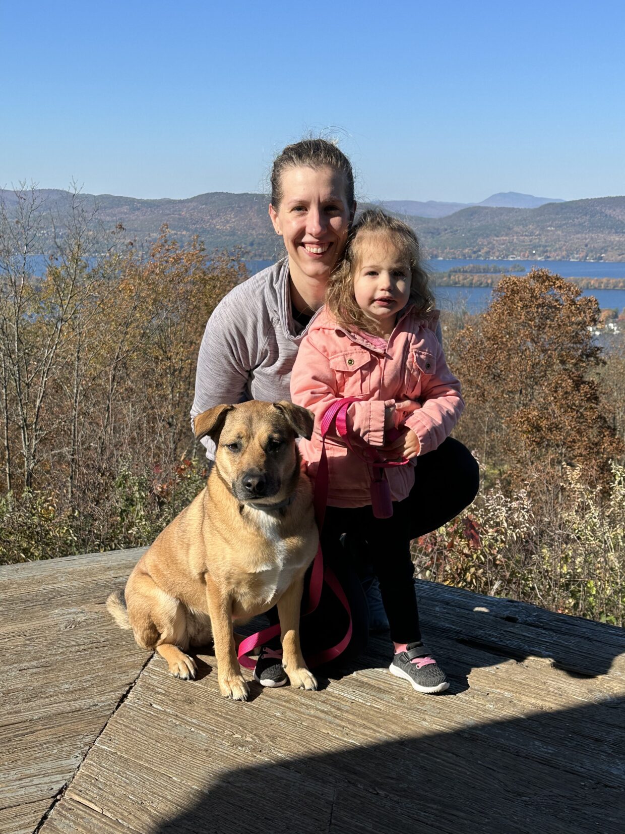 Dr. Nemeti hiking with her daughter and dog.