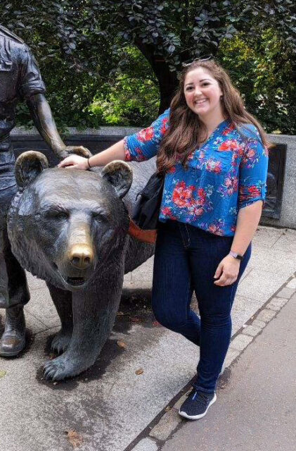 Dr. Wilson with a bear statue